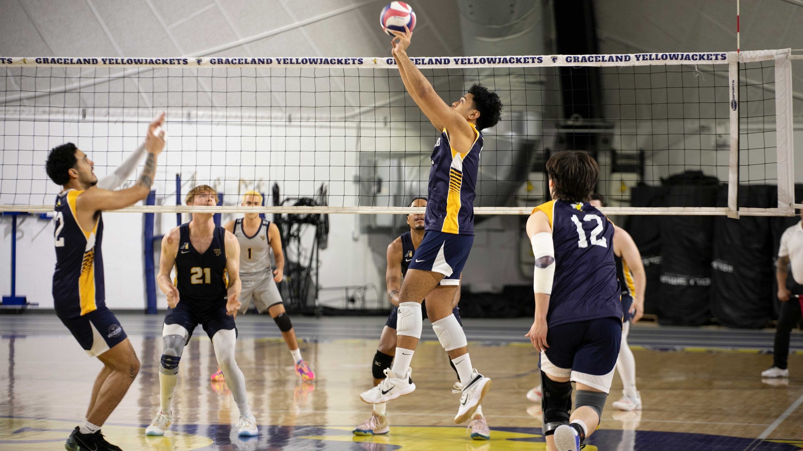 Graceland Battles in Five-Set Match Against St. Ambrose